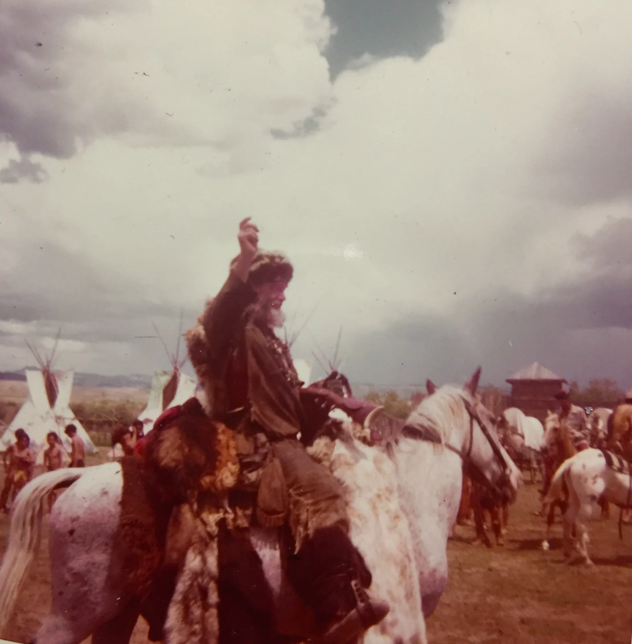 Modern day mountain man Timberjack Joe and his dog, Tuffy (riding on the horse behind Timberjack) at the Pinedale, Wyoming Rendezvous, July, 1974. Photo by Bobby Bridger