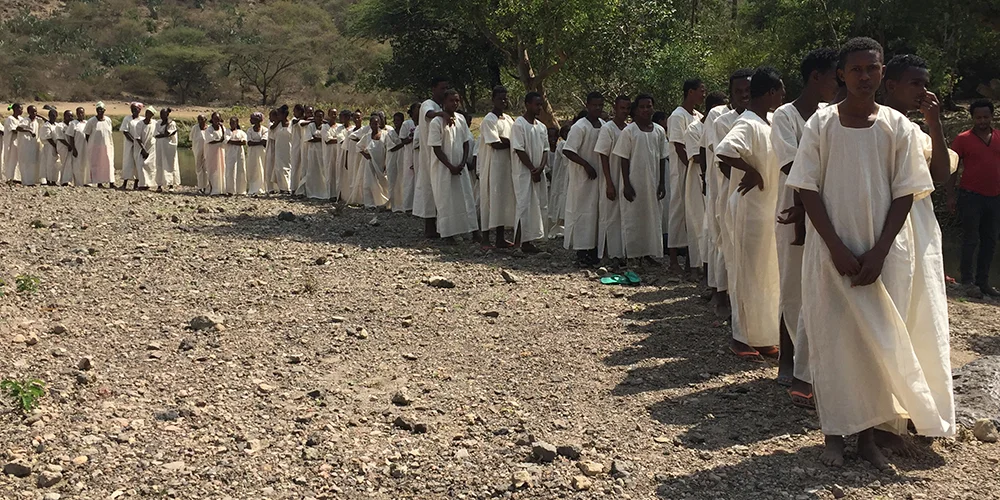 IMAGE - STORY - BANNER - 10YRS ETHIOPIA - Babtism Line (Chuck W).jpg