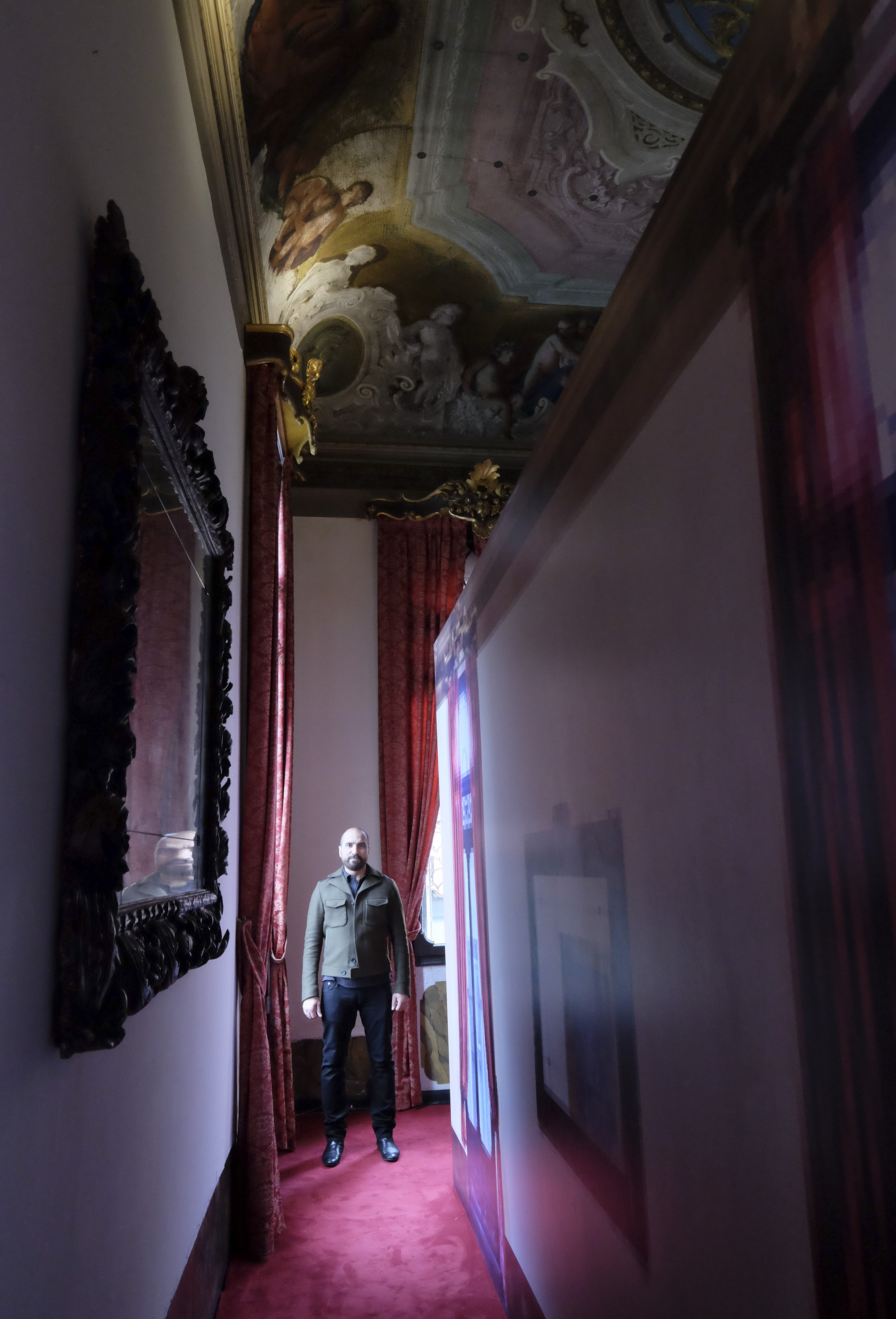 Rashid Rana with his work, A mirror lies vacant at Palazzo Benzon in Venice Photo credit- Marco Secchi 2.jpg