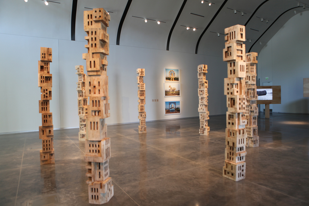 Gigi Scaria, ‘Woodhenge’, 2016, wood, paint, glue, 144 in each (7 poles). Image courtesy the artist.