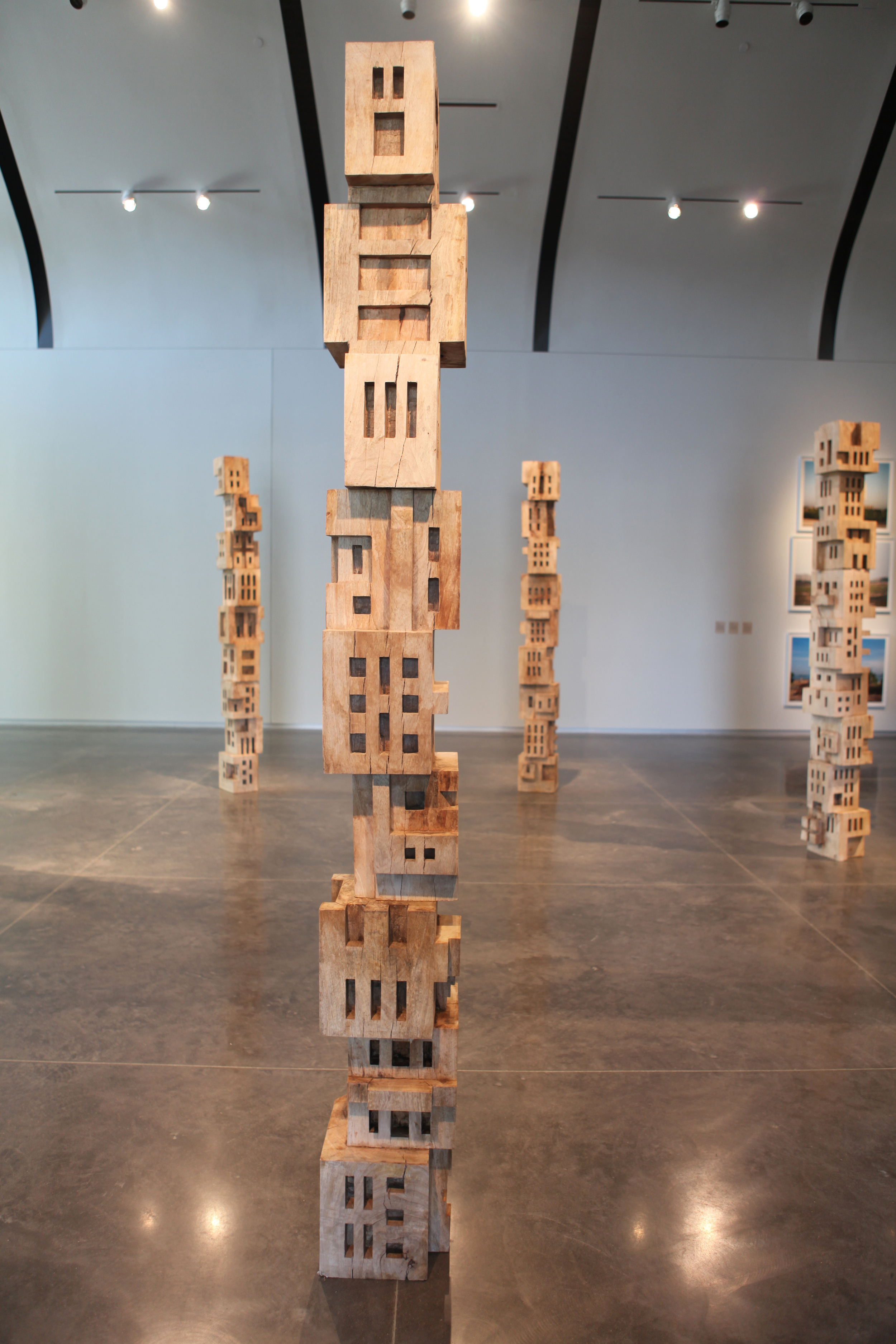 Gigi Scaria, ‘Woodhenge’, 2016, wood, paint, glue, 144 in each (7 poles). Image courtesy the artist.