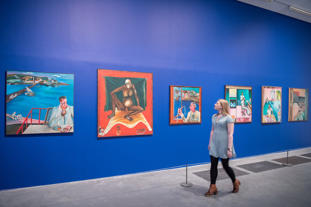  Bhupen Khakhar, “You Can’t Please All”, Tate Modern, 2016, installation view. From left to right: ‘Man Eating Jalebi’, 1975, oil paint on canvas, 112 x 112 cm; ‘Hathayogi’, 1978, oil paint on canvas, 137 x 122 cm; ‘Window Cleaner’, 1982, oil paint o
