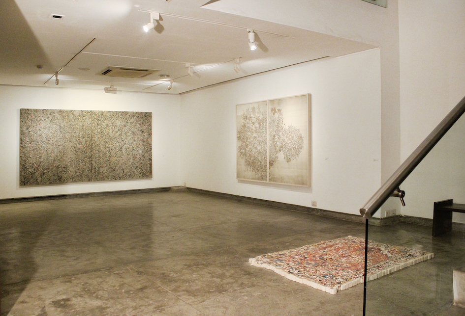  G R Iranna, “Ether is all that is”, 21 January – 9 March 2017, Gallery Espace, New Delhi. Installation view with ‘Psychic Sound’, 2016, acrylic on tarpaulin, 66 x 120 in (Left) and ‘Beautiful Burning Tree’, 2016, silver foil on paper 60 x 80 (Right)