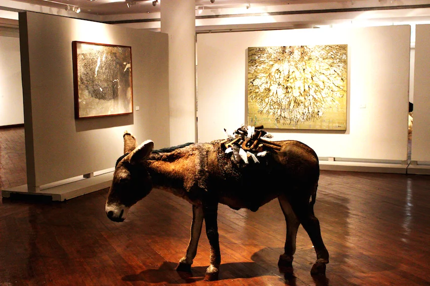 G. R. Iranna . (Foreground) Wounded Tools . 2008. (On the wall) Forced Autumn . 2015.