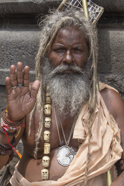 A sadhu at Nashik. I love this guys skull necklace carved from bones.