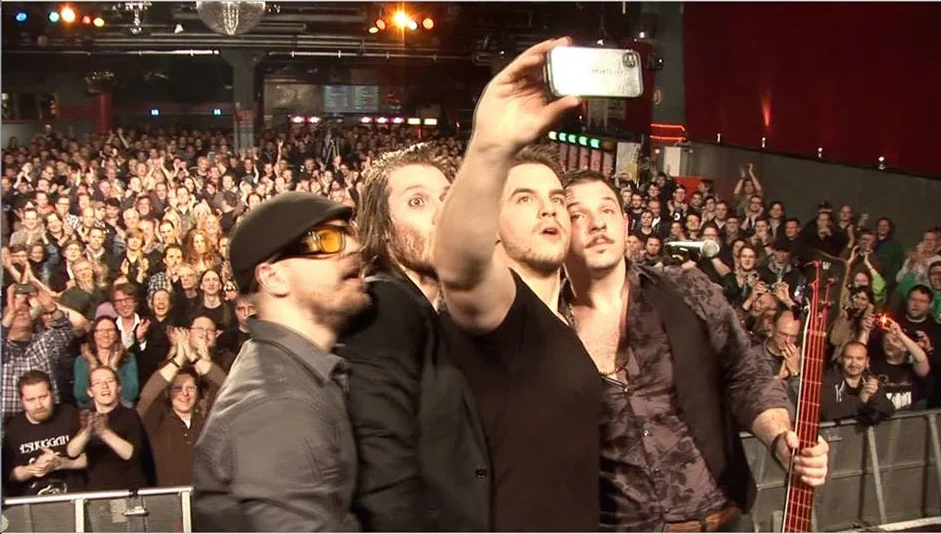 Louis taking an epic selfie in Cologne, Germany with his band JOLLY. 