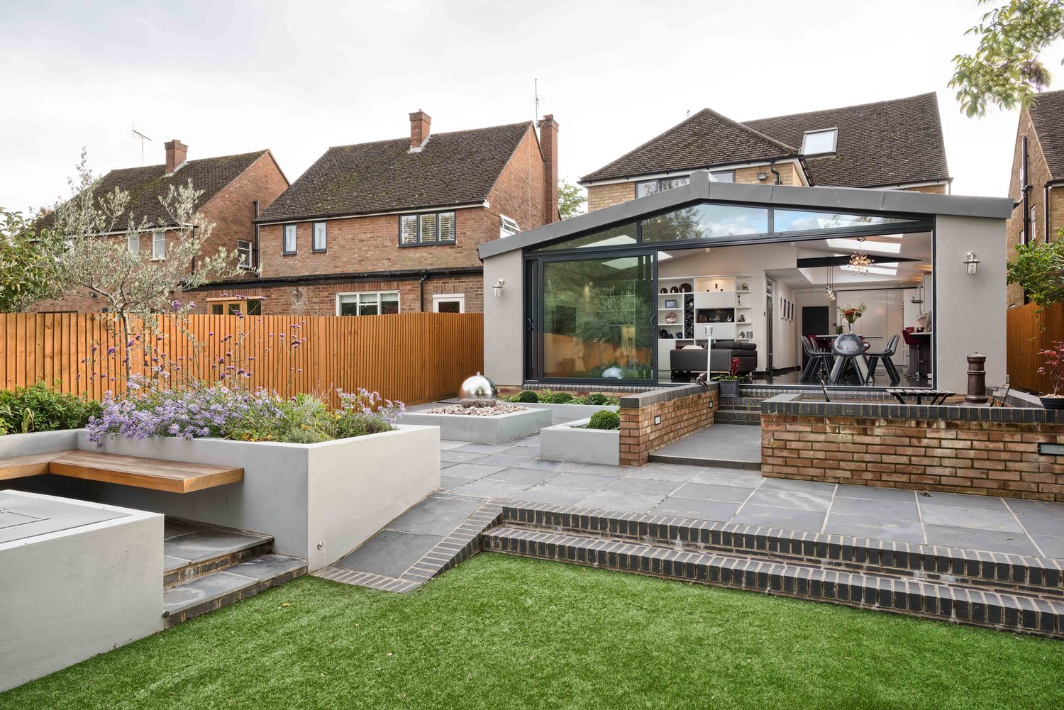 The garden view of a modern house extension by Harvey Norman Architects St Albans