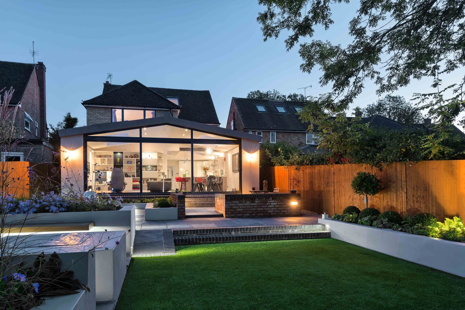 The garden view of a modern house extension by Harvey Norman Architects St Albans