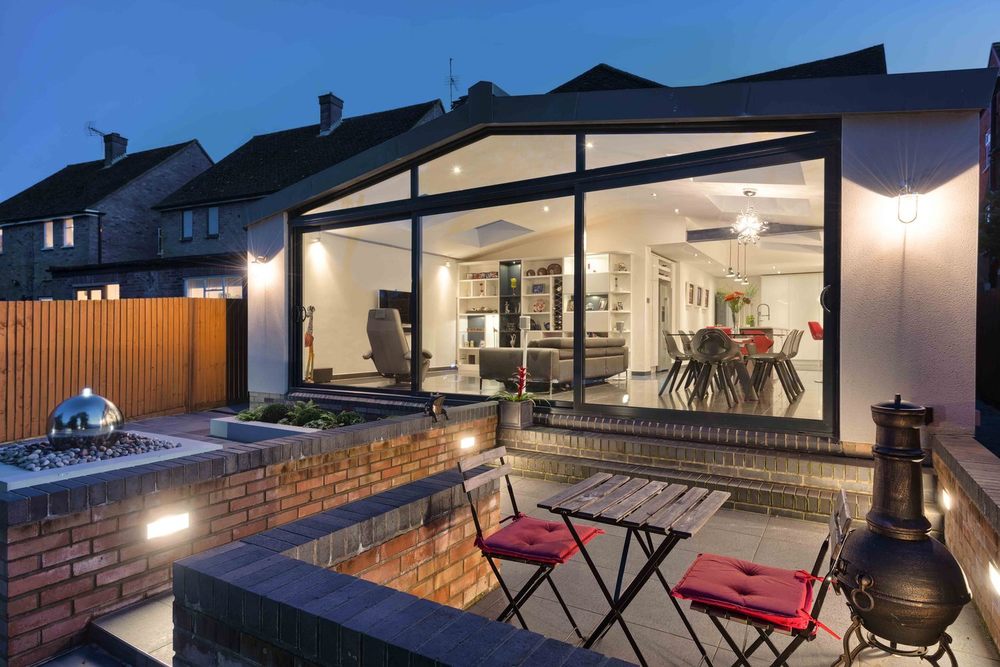 Outside sitting area of a modern house extension by Harvey Norman Architects St Albans