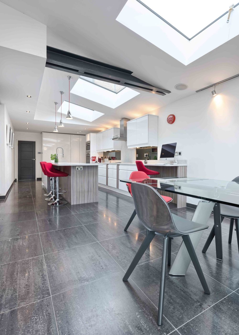 Dining room chairs of a modern house extension by Harvey Norman Architects St Albans