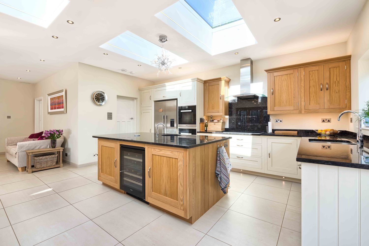 A kitchen with lots of light from a modern house extension by Harvey Norman Architects St Albans