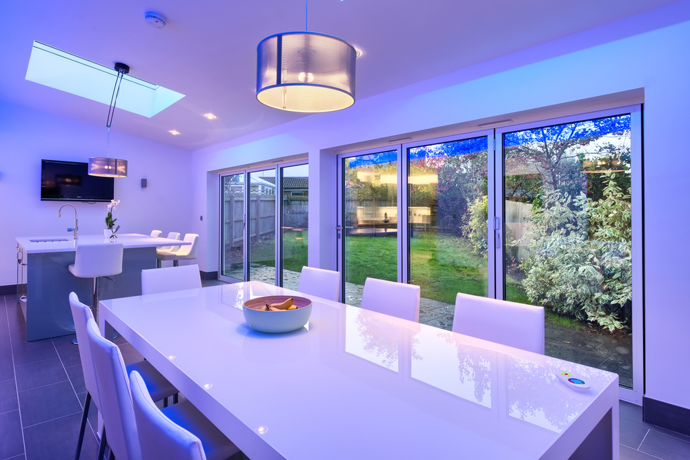 Blue light garden view of a lighting house extension by Harvey Norman Architects Cambridge