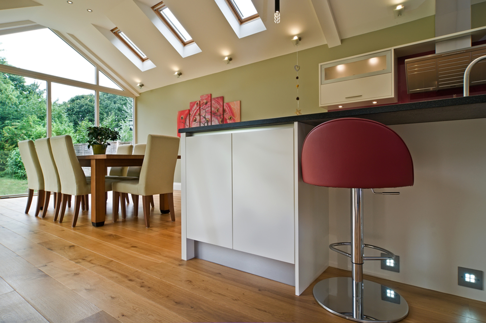 Kitchen breakfast bar stool of a house extension by Harvey Norman Architects Cambridge