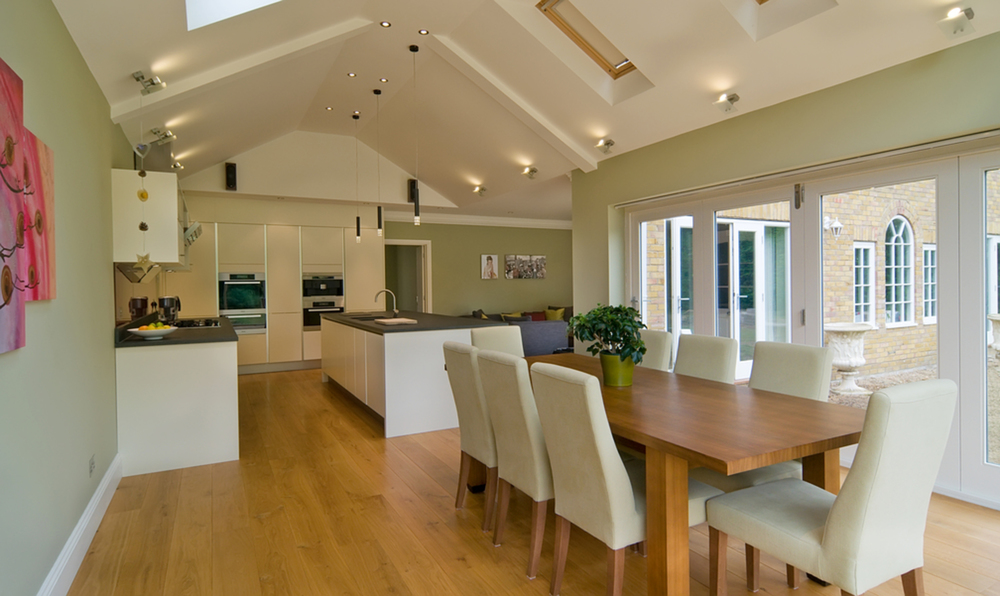 Dining room table kitchen view of a house extension by Harvey Norman Architects Cambridge