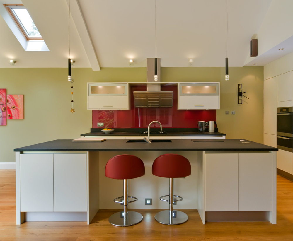 Kitchen breakfast bar stool of a house extension by Harvey Norman Architects Cambridge