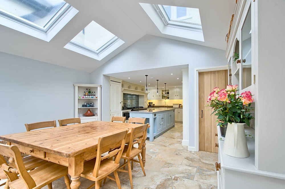 Dining room table kitchen view of a house redesign by Harvey Norman Architects Cambridge