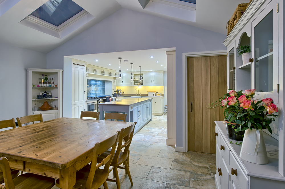 Dining room table night of a house redesign by Harvey Norman Architects Cambridge