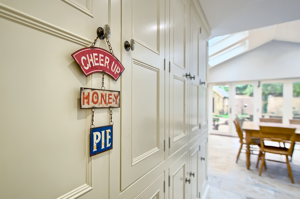 Kitchen cupboards hanged signs of a house redesign by Harvey Norman Architects Cambridge