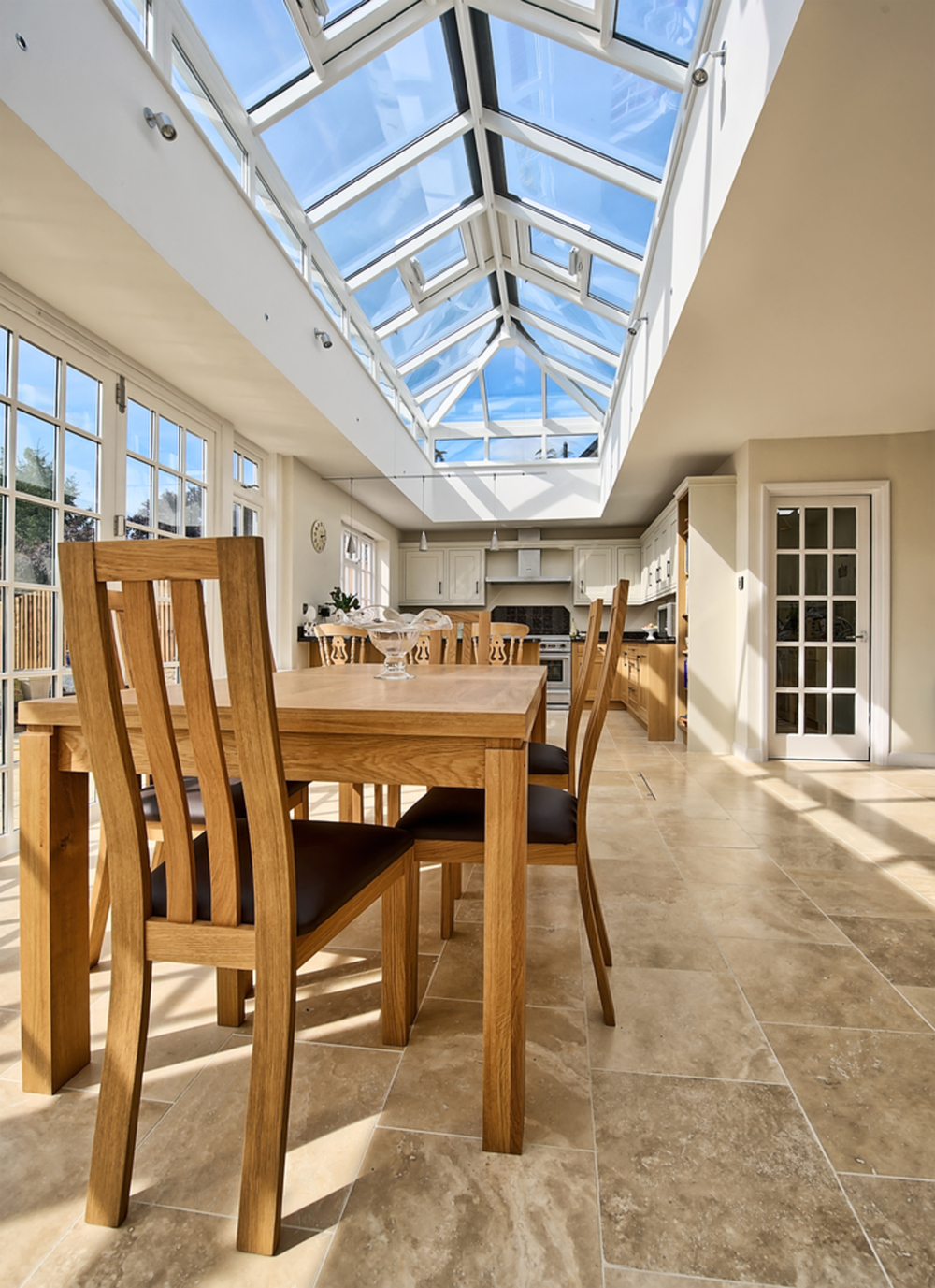 Skylight and dining room table of a house extension by Harvey Norman Architects St Albans