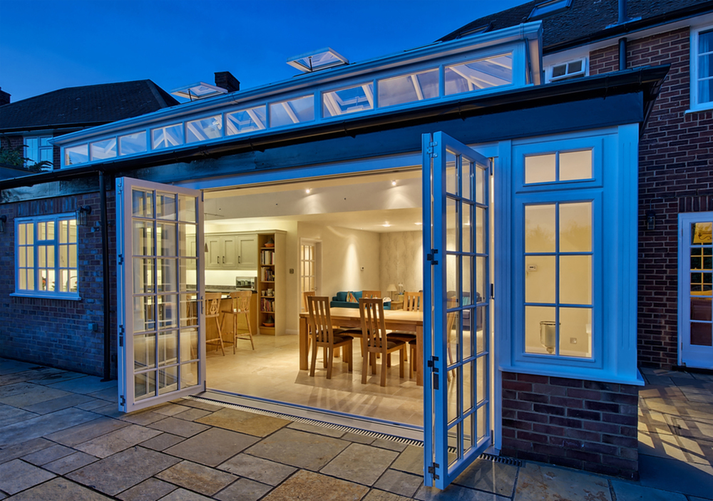 Outside sliding doors night lighting of a house extension by Harvey Norman Architects St Albans