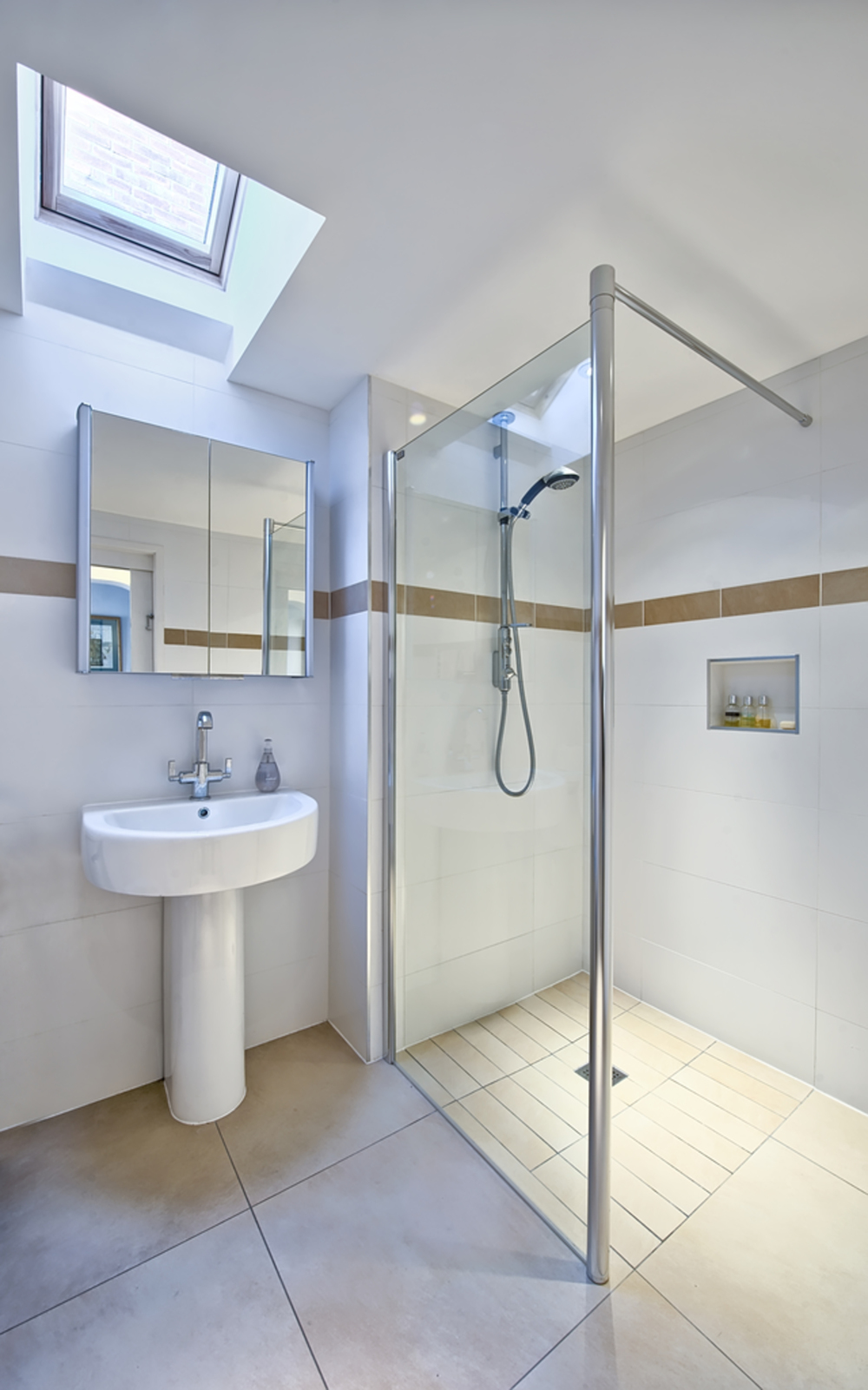 Modern bathroom shower of a house extension by Harvey Norman Architects Cambridge