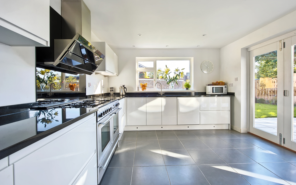 Kitchen counter of a house extension by Harvey Norman Architects Cambridge