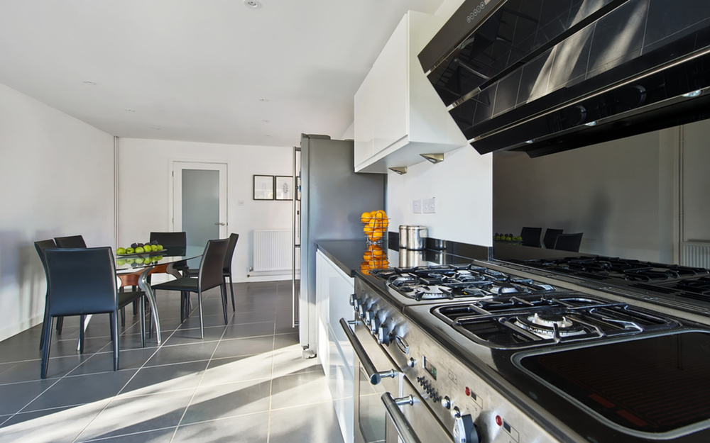 Kitchen appliances worktop of a house extension by Harvey Norman Architects Cambridge