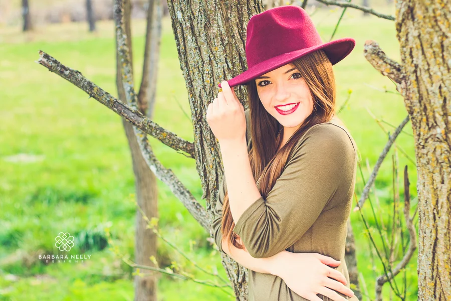 Cute senior girl pose with hat by Barbara Neely Designs