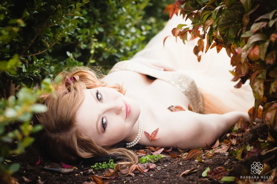 Beautiful red haired senior girl in spring