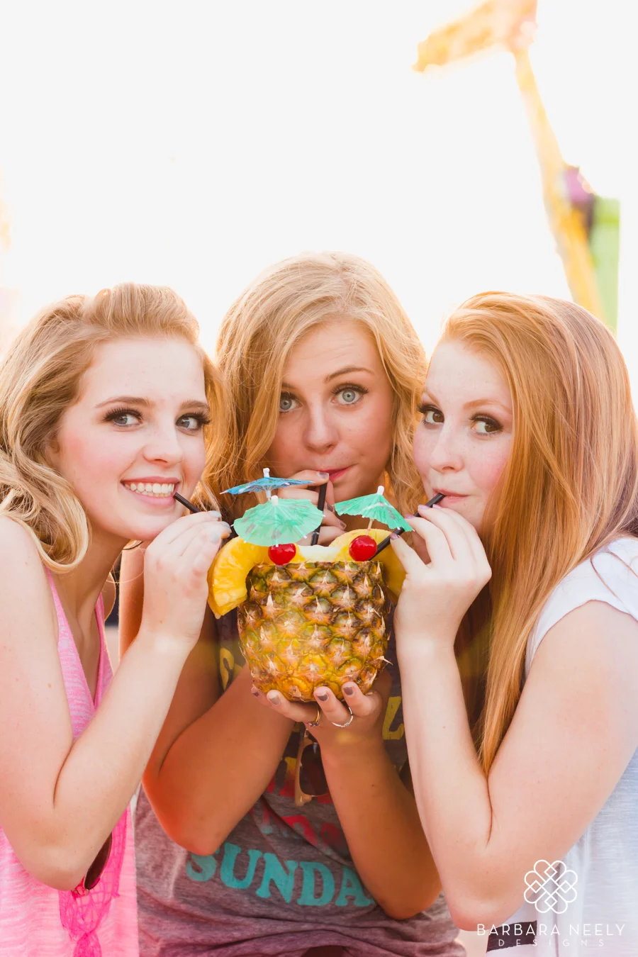 Senior girl group session at the fair with a pineapple drink
