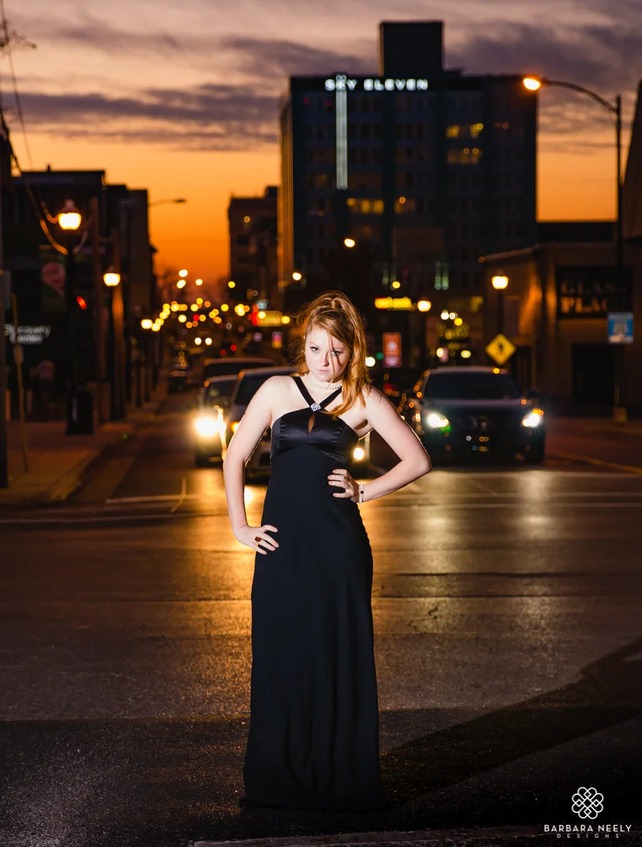 Senior portraits at sunset in the city streets