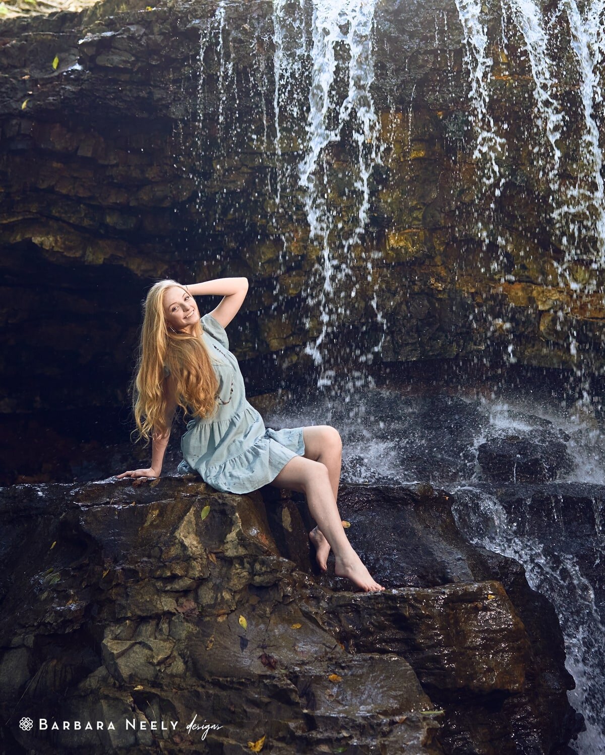 bre in a waterfall northwest arkansas senior pictures.jpg