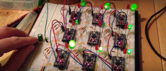 Nine NeuroBytes v0.3 prototypes on a breadboard