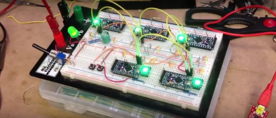 Five NeuroBytes v0.2 prototypes, shown in a ring configuration on a breadboard