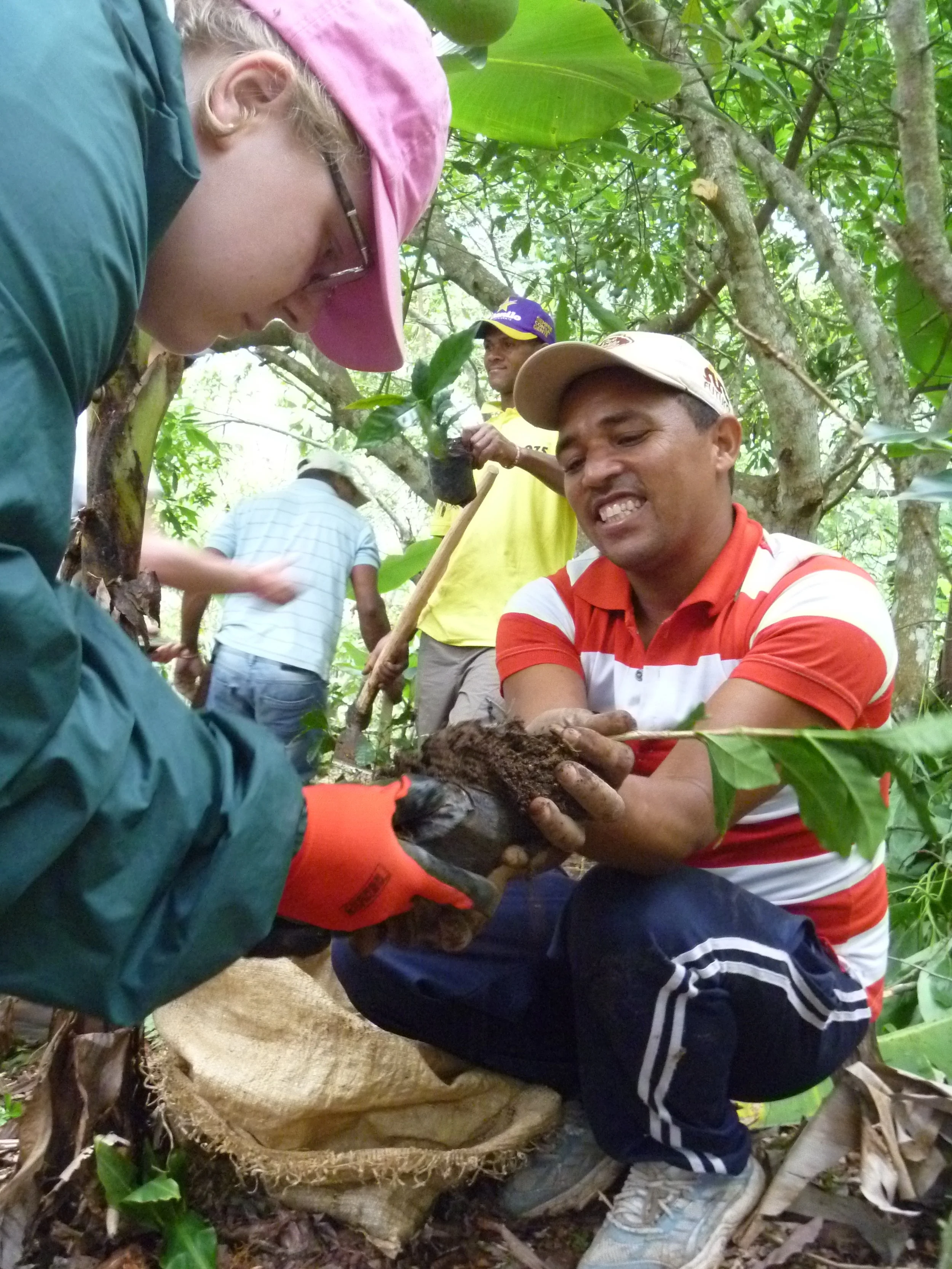 A Lycoming College student and El Naranjito farmer work to plant new trees in the community