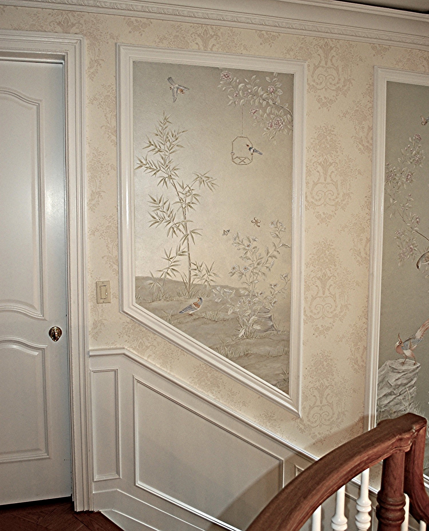 Beautiful hand painted panels ascend a graceful staircase in Fort Solonga New York. 