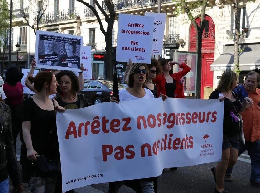 Photo: "Stop the repression, not our clients"/"Stop our attackers, not our clients", photo courtesy of STRASS