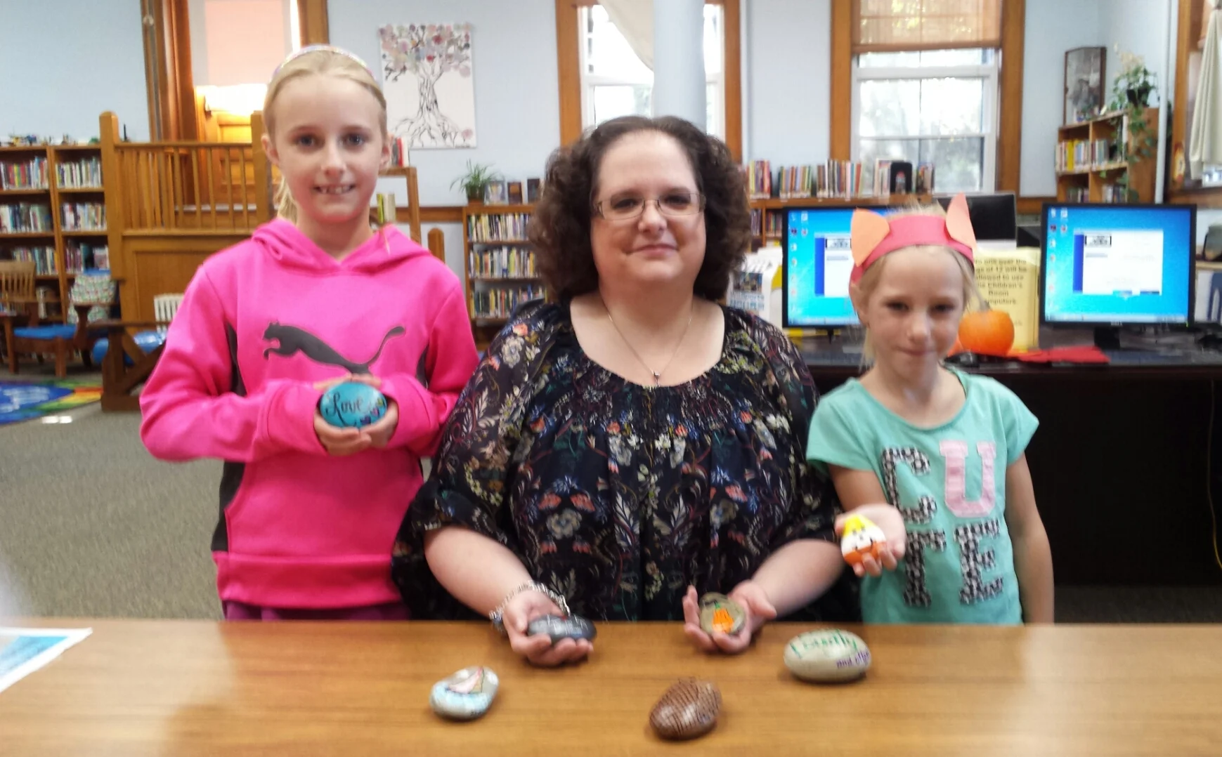 Janelle Wallace, center, with two of her Fulton, New York Rock friends.