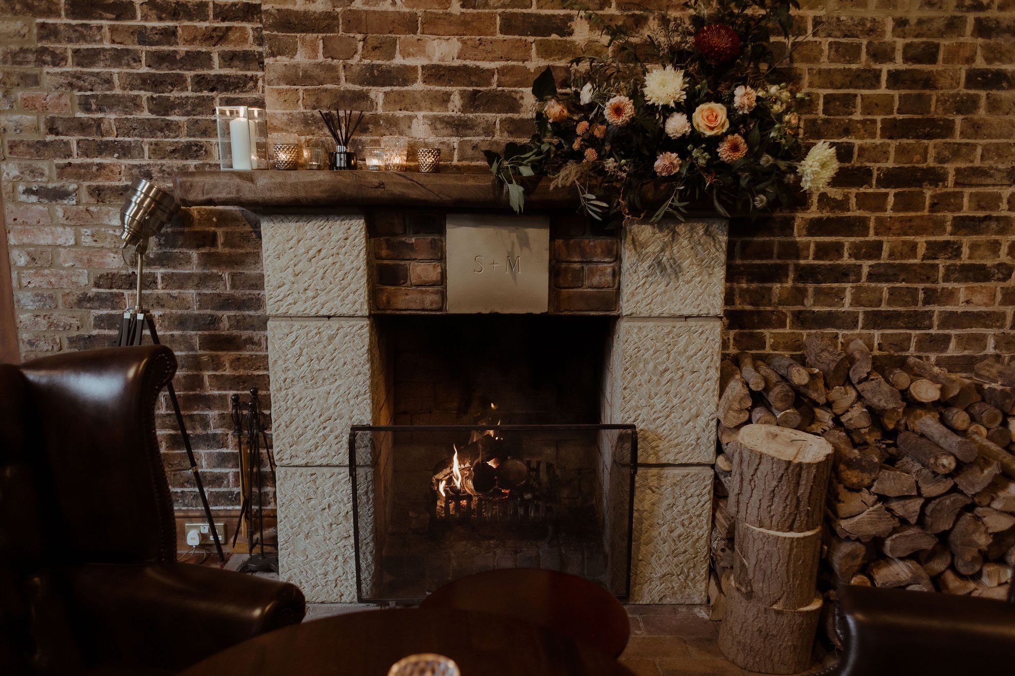 Interior winter lodge wedding at Yosemite National Park - Fireplace at wedding. Cosy winter wedding ideas