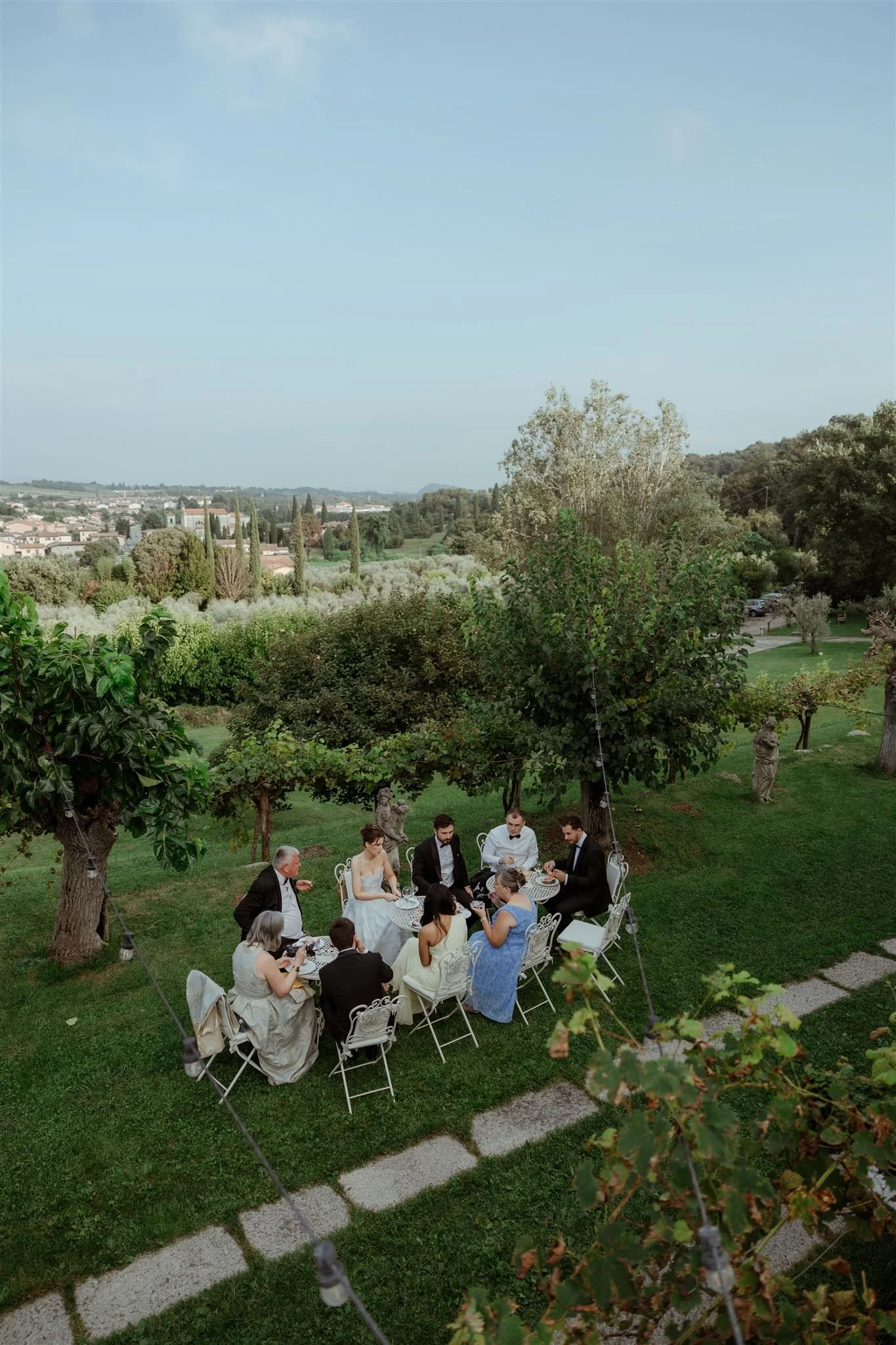 Wedding guests eating at Villa Arcadio, overlooking Lake Garda