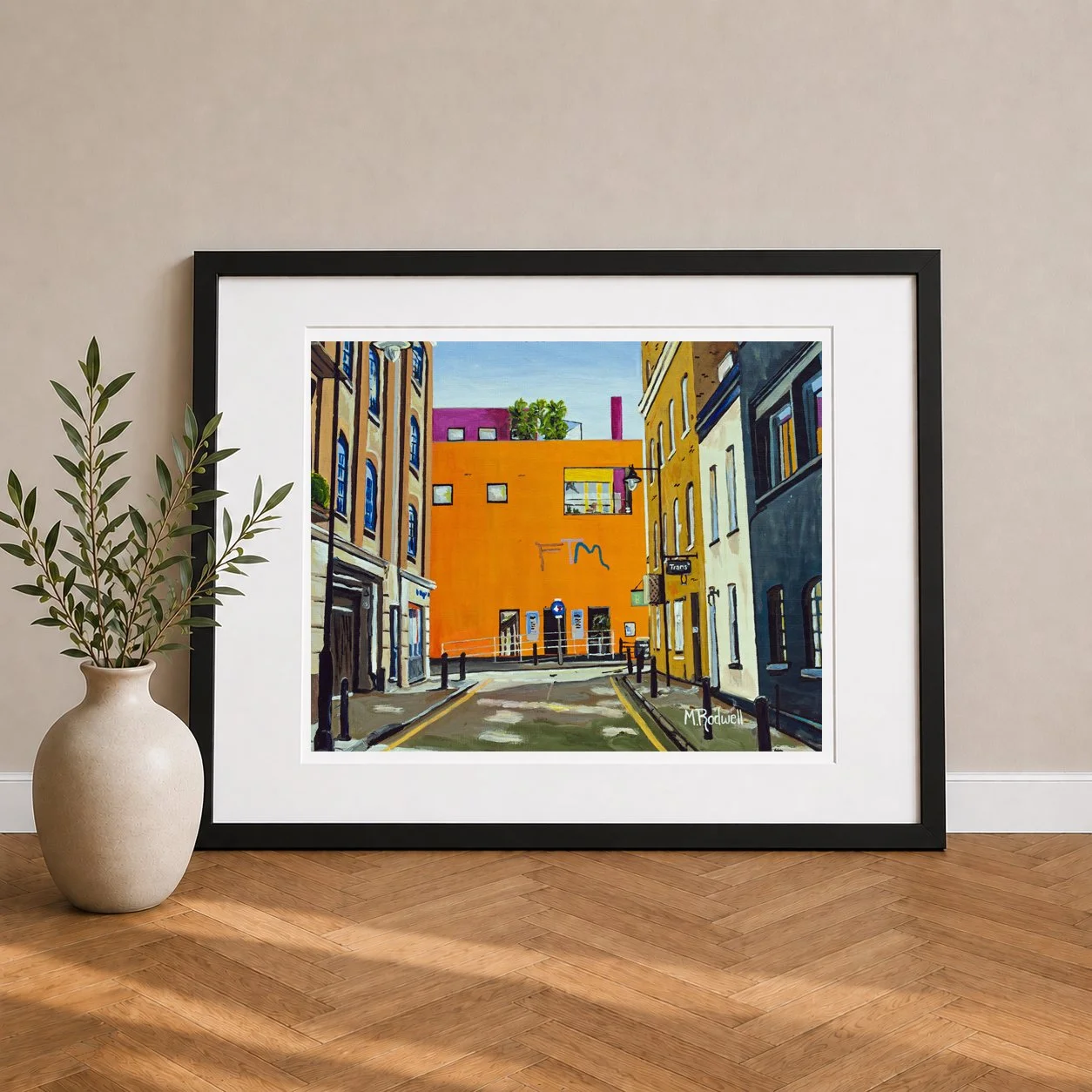 View of Fashion and Textile Museum on Bermondsey Street painted with its garish bright colours reflecting fashion ikon Zandra Rhodes