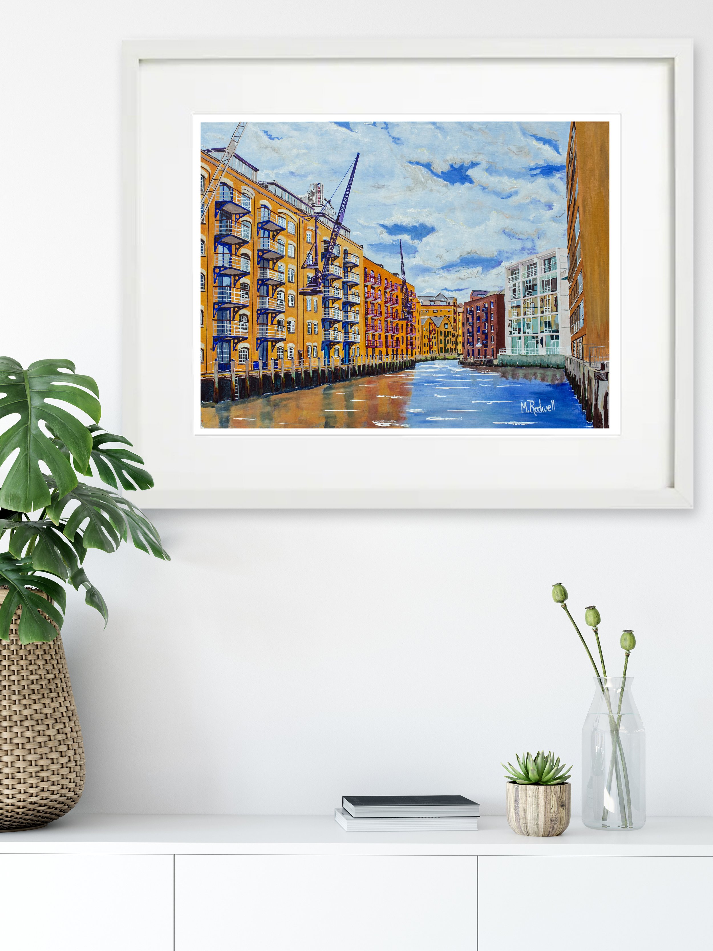 Print of a sunny St Saviour's Dock scene, with the Thames reflecting colourful buildings. Ideal for gifts or creating a stylish, designer home ambiance