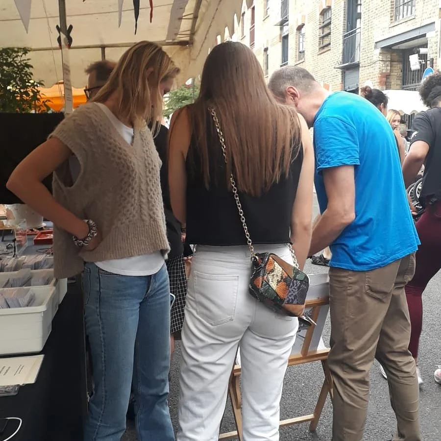 Bermondsey Street Festival shoppers admiring the London Artwork by Magnus Rodwell