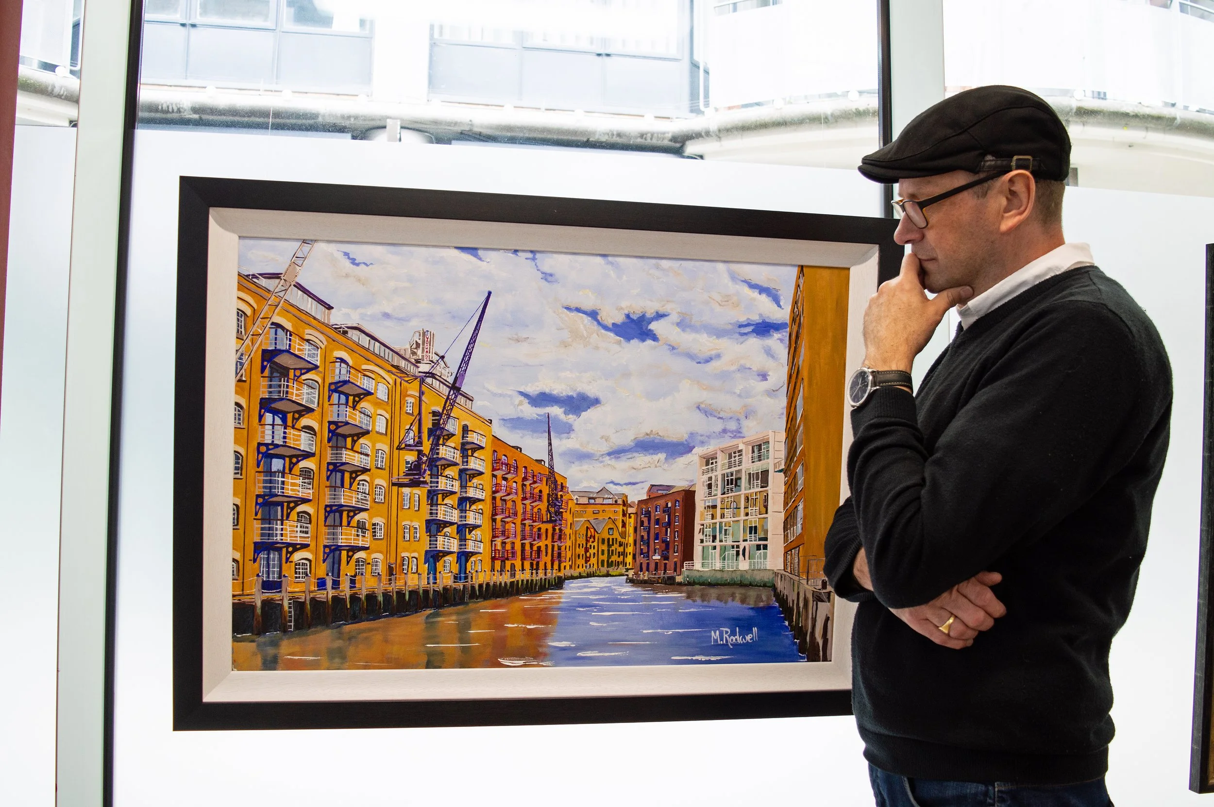 London Artist Magnus Rodwell Selfie in front of his painting of Saint Saviours Dock Shad Thames.