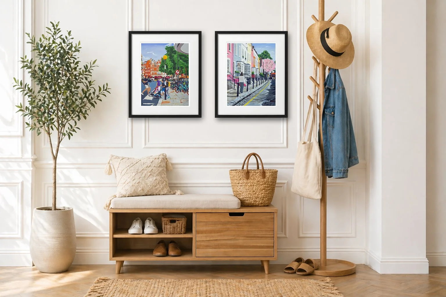 Two London framed prints of Chelsea hanging on a wall in a hallway.  Sloane square print with people crossing the road.  Second Bywater st with a single girl walking.  All displayed in a hallway with coat stand, tree, and bench to sit on
