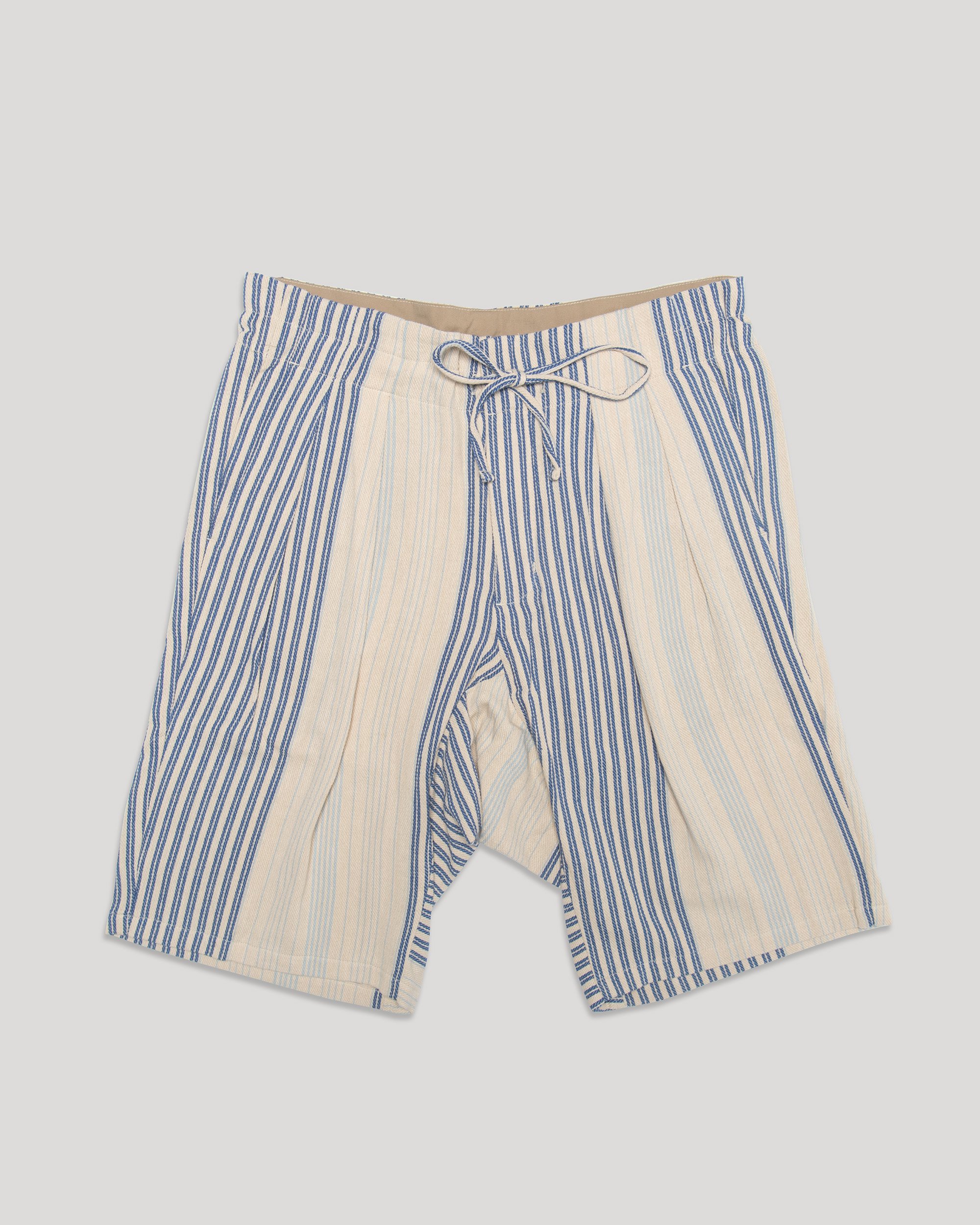 Shorts with Double pleats at the front, along with the drop crotch, create a striking silhouette. 100% cotton Original Meg Company fabric with vintage inspiration.