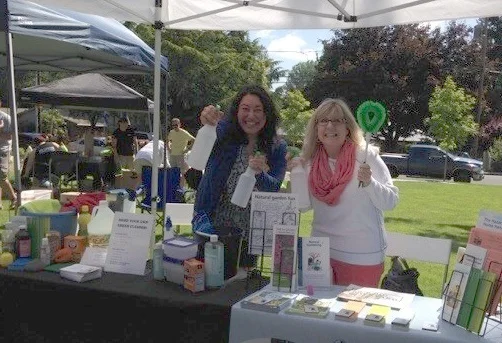 Sara, left, at a healthy homes booth.