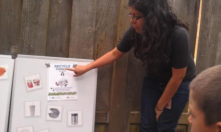 Cristi Morales Muñoz (Class 48) engages kids in recycling.