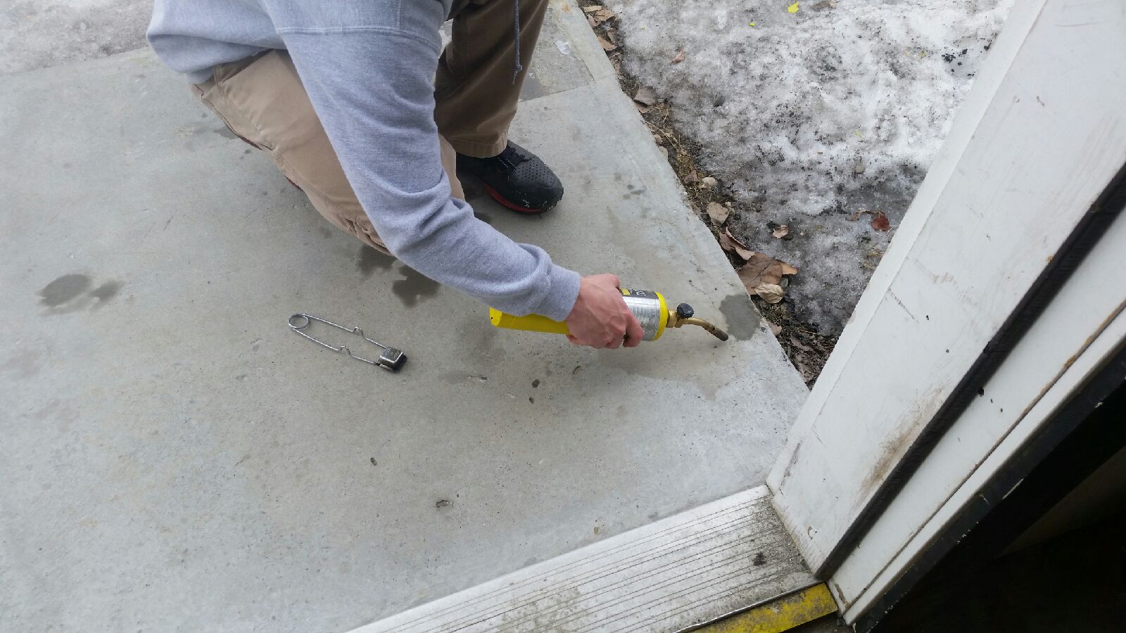 STEP 1: Clean surface with appropriate cleaner or solvent and let it dry fully. *Apply product in temperatures above 50 degrees Fahrenheit/10 degrees Celsius. * Use appropriate degreaser/cleaner to keep material and surrounding surfaces free of debris and grease. *In this application, a torch was used to help remove excess moisture from dam p concrete.