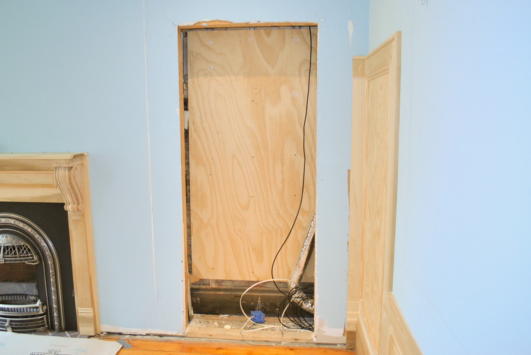 BEFORE. We were hired to build a TV unit for this space. The wall paneling was existing.